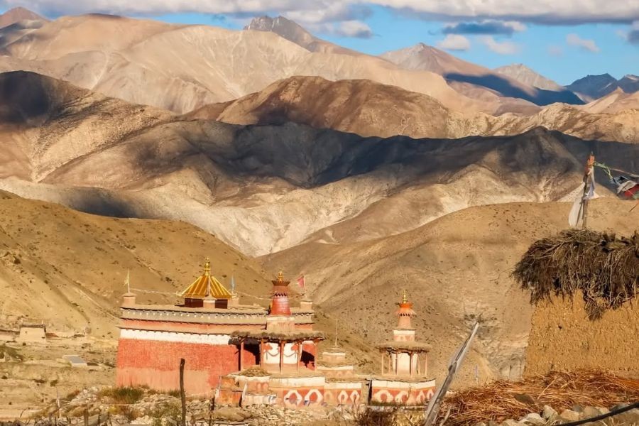 Traditional Tibetan monastery in Upper Dolpo with barren mountains in background